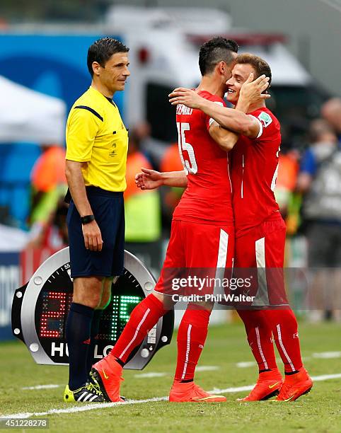 Xherdan Shaqiri of Switzerland is substituted by Blerim Dzemaili during the 2014 FIFA World Cup Brazil Group E match between Honduras and Switzerland...