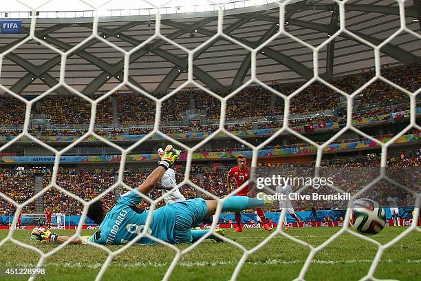 Xherdan Shaqiri of Switzerland shoots and scores his team's third goal past goalkeeper Noel Valladares of Honduras and completes his hat trick during...