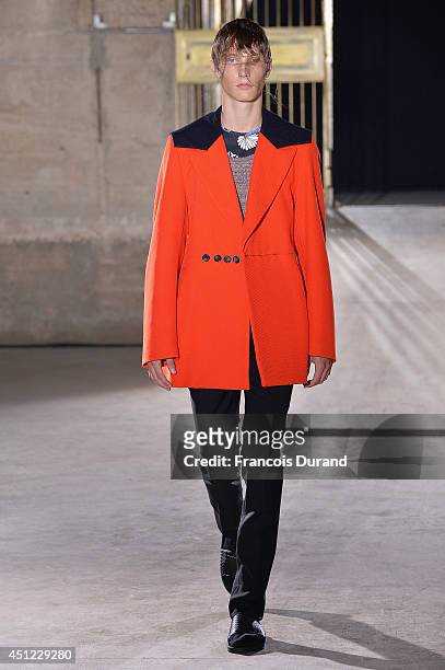 Model walks the runway during the Raf Simons show as part of the Paris Fashion Week Menswear Spring/Summer 2015 on June 25, 2014 in Paris, France.