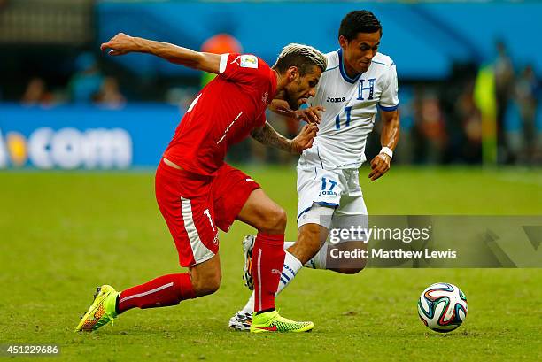 Valon Behrami of Switzerland and Andy Najar of Honduras compete for the ball during the 2014 FIFA World Cup Brazil Group E match between Honduras and...