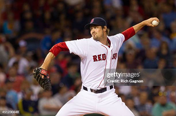 Andrew Miller of the Boston Red Sox pitches against the Minnesota Twins during the eighth inning at Fenway Park on June 16, 2014 in Boston,...