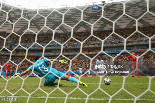 Xherdan Shaqiri of Switzerland shoots and scores his team's third goal and complete his hat trick during the 2014 FIFA World Cup Brazil Group E match...