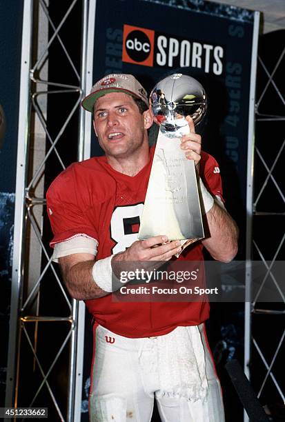 Steve Young of the San Francisco 49ers holds the Vince Lombardi trophy after the 49ers defeated the San Diego Chargers in Super Bowl XXIX on January...