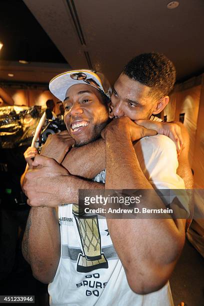 Tim Duncan and Kawhi Leonard of the San Antonio Spurs celebrates after winning the NBA Championship against the Miami Heat during Game Five of the...