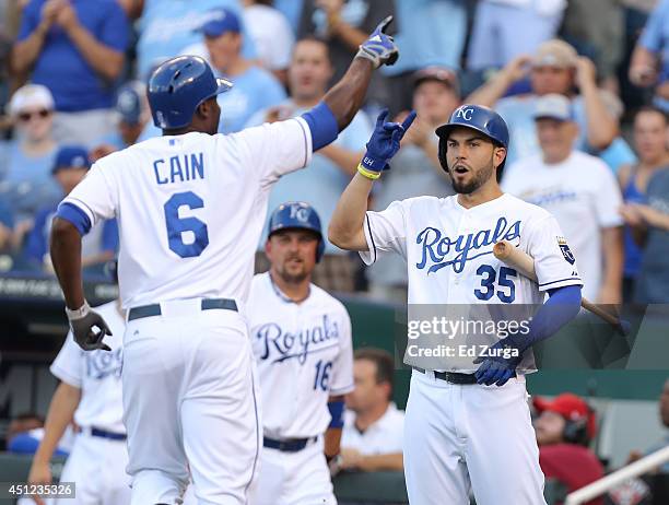 Lorenzo Cain of the Kansas City Royals celebrates his home run with Eric Hosmer of the Kansas City Royals in the first inning during a game against...