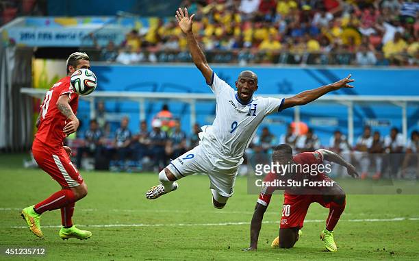 Jerry Palacios of Honduras is challenged by Valon Behrami and Johan Djourou during the 2014 FIFA World Cup Brazil Group E match between Honduras and...