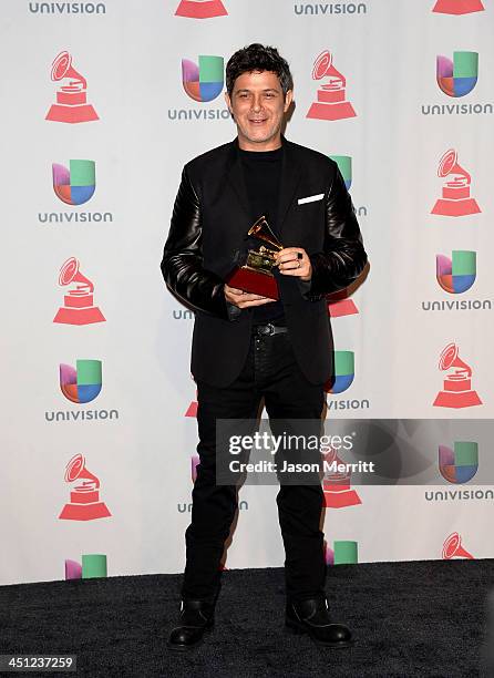 Recording artist Alejandro Sanz, winner of the Best Contemporary Pop Vocal Album for 'La Música No Se Toca poses in the press room at the 14th Annual...