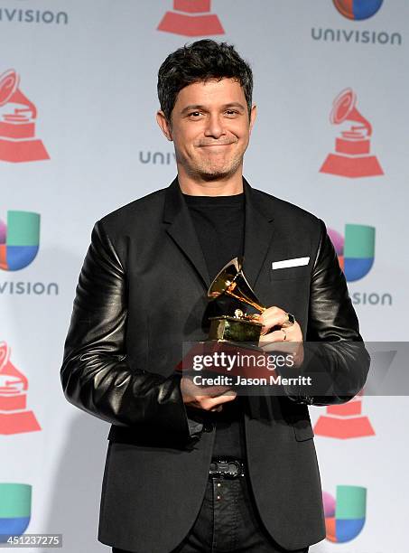 Recording artist Alejandro Sanz, winner of the Best Contemporary Pop Vocal Album for 'La Música No Se Toca poses in the press room at the 14th Annual...