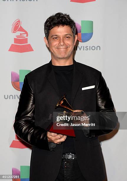 Recording artist Alejandro Sanz, winner of the Best Contemporary Pop Vocal Album for 'La Música No Se Toca poses in the press room at the 14th Annual...