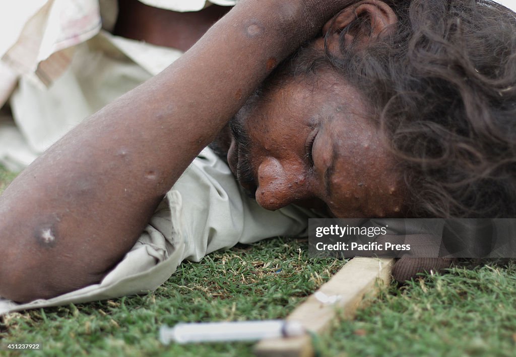 A group of Pakistanis take illegal drugs at a public park in...
