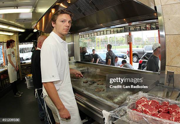 Draft Top Prospect Sam Reinhart makes cheesesteakes at Geno's Steaks on June 25, 2014 in Philadelphia, Pennsylvania.