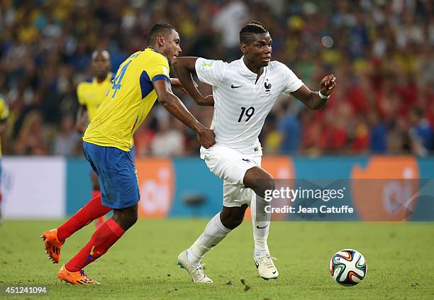 Paul Pogba of France under pressure of Oswaldo Minda of Ecuador during the 2014 FIFA World Cup Brazil Group E match between Ecuador and France at...