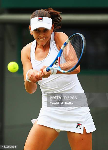 Chanelle Scheepers of South Africa in action during her Ladies' Singles second round match against Serena Williams of the United States on day four...