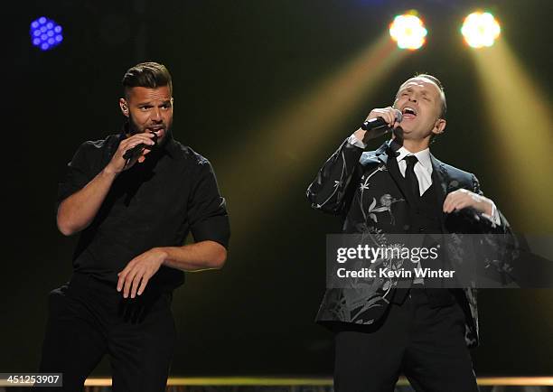 Recording artists Ricky Martin and Miguel Bose perform onstage during The 14th Annual Latin GRAMMY Awards at the Mandalay Bay Events Center on...