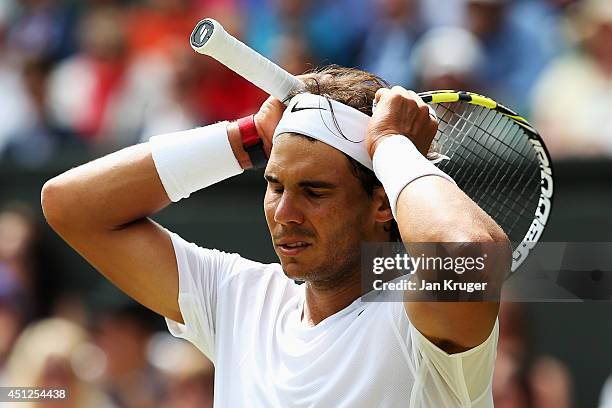 Rafael Nadal of Spain reacts during his Gentlemen's Singles second round match against Lukas Rosol of Czech Republic on day four of the Wimbledon...