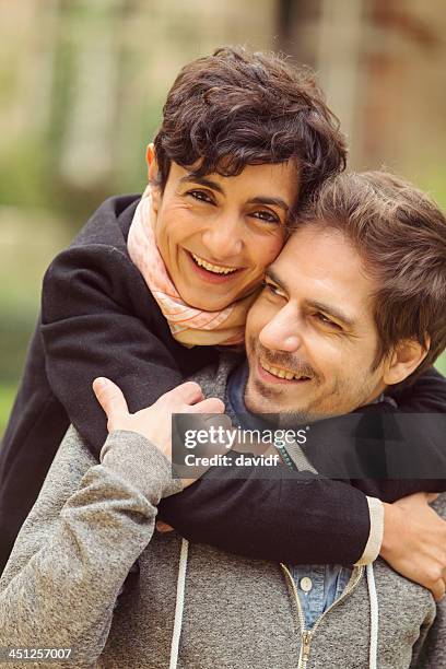 hugging young couple in love - paris autumn stock pictures, royalty-free photos & images