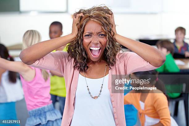 i can't take it anymore! - naughty kids in classroom stock pictures, royalty-free photos & images