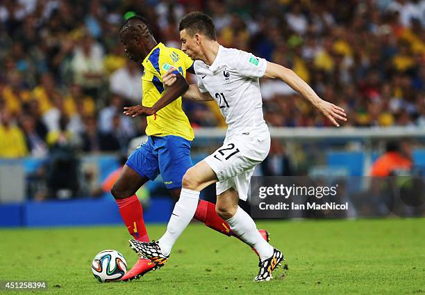 Enner Valencia of Ecuador vies with Laurent Koscielny of France during the 2014 FIFA World Cup Brazil Group E match between Ecuador and France at the...