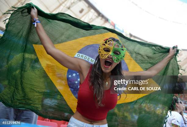 Fan cheers prior to the Group G football match between Portugal and Ghana at the Mane Garrincha National Stadium in Brasilia during the 2014 FIFA...