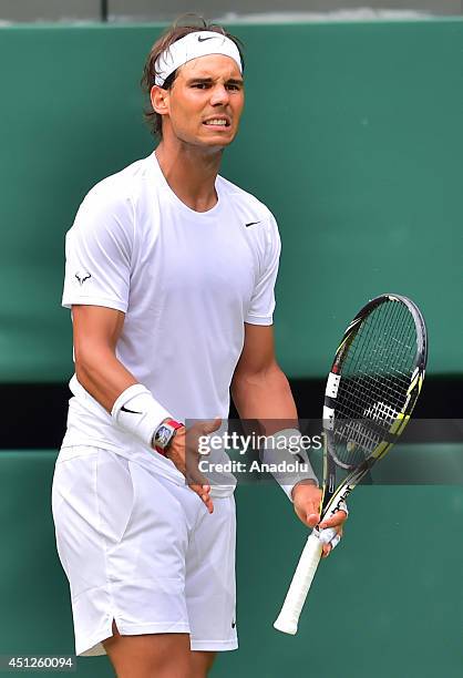 Rafael Nadal of Spain celebrates after defeating Lukas Rosol of Czech Republic in their men's singles second round match on day four of the 2014...