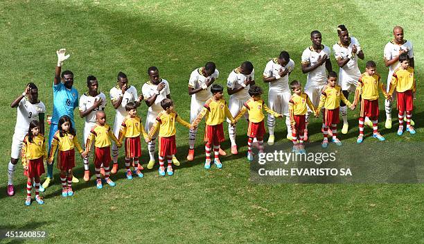 Ghana's team line-up and sing their national anthem prior to the kick-off of the Group G football match between Portugal and Ghana at the Mane...