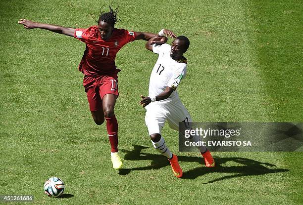 Portugal's forward Eder and Ghana's midfielder Mohammed Rabiu vie for the ball during the Group G football match between Portugal and Ghana at the...