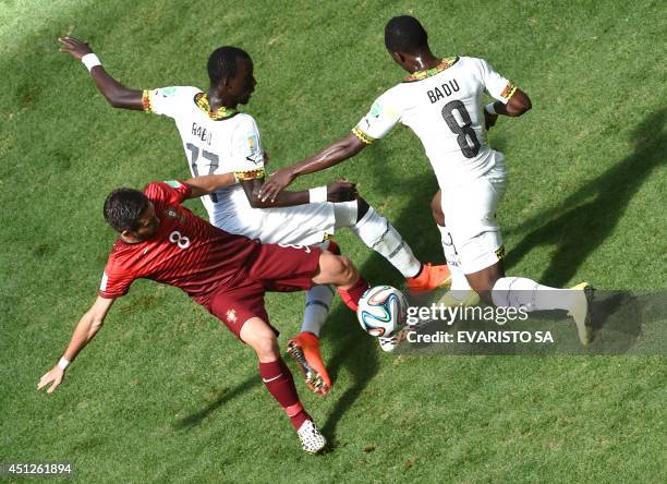 Portugal's midfielder Joao Moutinho, Ghana's midfielder Mohammed Rabiu and Ghana's midfielder Emmanuel Agyemang Badu vie for the ball during the...