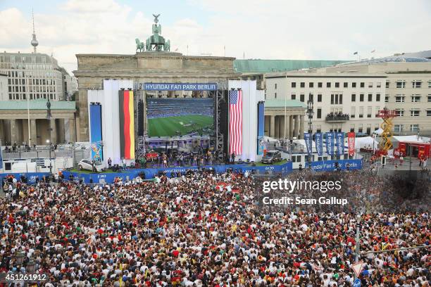 Germany fans watch the Germany-USA World Cup match at the Hyundai Fan Park public viewing in front of the Brandenburg Gate in Tiergarten park on June...