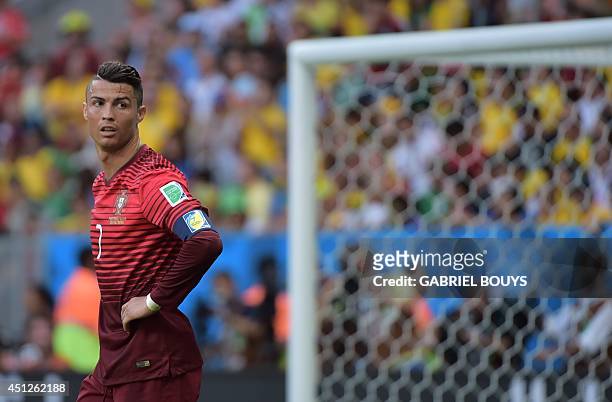 Portugal's forward and captain Cristiano Ronaldo reacts during the Group G football match between Portugal and Ghana at the Mane Garrincha National...