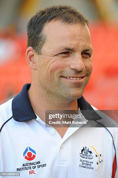 Academy high performance coach Brad Johnson speaks to development players during a 2013 NAB AFL Draft media session at Metricon Stadium on November...