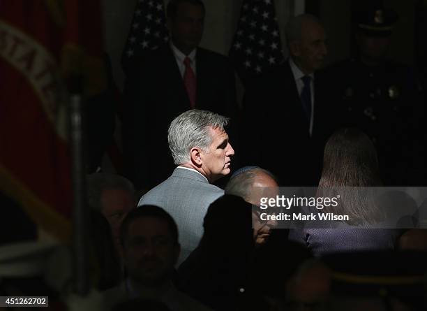 Patch of light hits House Majority Whip Kevin McCarthy during a Congressional Gold Medal ceremony at the U.S. Capitol, June 26, 2014 in Washington,...