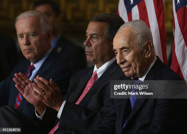 Israeli President Shimon Peres , House Speaker John Boehner , U.S. Vice President Joseph Biden listen to speakers during a Congressional Gold Medal...