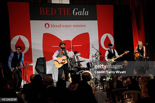 Drew Holcomb and the Neighbors perform during the Red Tie Gala Hosted by Blood:Water Mission and sponsored by Noodle & Boo at Hutton Hotel on...