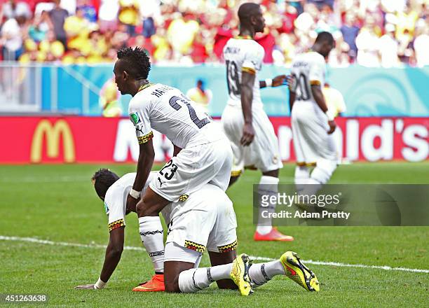 Harrison Afful consoles John Boye of Ghana after he scored an own goal during the 2014 FIFA World Cup Brazil Group G match between Portugal and Ghana...