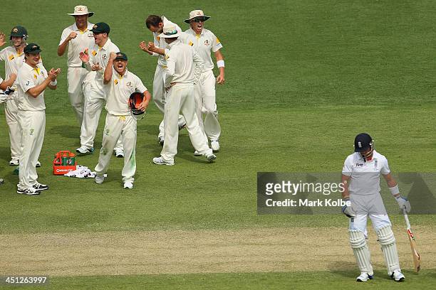 The Australain team celebrate as Matt Prior of England is given out after a third umpire referral during day two of the First Ashes Test match...