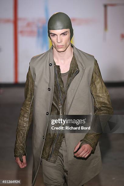 Model walks the runway during the Boris Bidjan Saberi show as part of the Paris Fashion Week Menswear Spring/Summer 2015 on June 26, 2014 in Paris,...