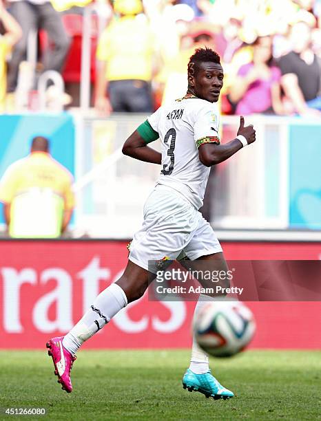 Asamoah Gyan of Ghana scores his team's first goal during the 2014 FIFA World Cup Brazil Group G match between Portugal and Ghana at Estadio Nacional...