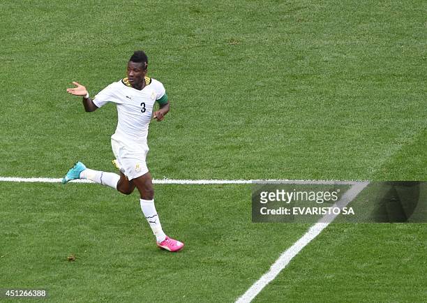 Ghana's forward and captain Asamoah Gyan celebrates after scoring a goal during the Group G football match between Portugal and Ghana at the Mane...