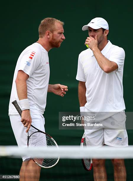 Lukas Dlouhy of Czech Republic and Paul Hanley of Australia and during their Gentlemen's Doubles first round match against Santiago Gonzalez of...