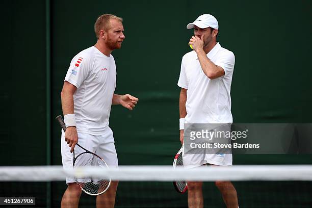 Lukas Dlouhy of Czech Republic and Paul Hanley of Australia and during their Gentlemen's Doubles first round match against Santiago Gonzalez of...