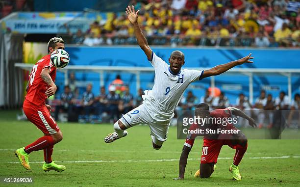 Jerry Palacios of Honduras is challenged by Valon Behrami and Johan Djourou during the 2014 FIFA World Cup Brazil Group E match between Honduras and...