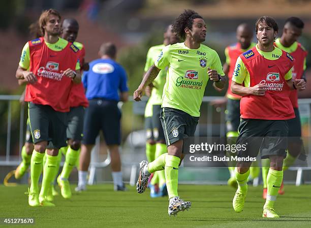 Henrique, Marcelo and Maxwell in action during a training session of the Brazilian national football team at the squad's Granja Comary training...