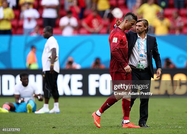 Cristiano Ronaldo of Portugal is consoled by Joao Vieira Pinto, a member of the Portuguese Football Federation, after the 2014 FIFA World Cup Brazil...