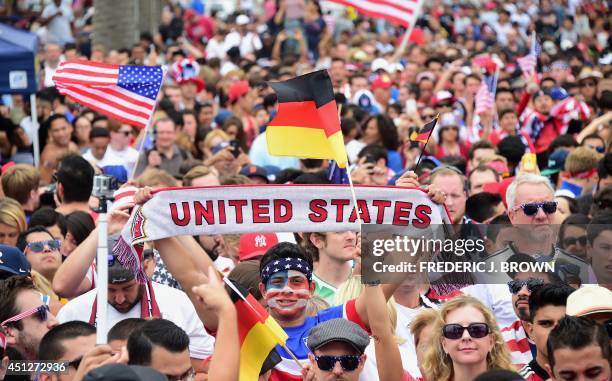 Fans show their support while gathered to watch off a big screen at Hermosa Beach, California on June 26 asThomas Muller scored the lone goal for...