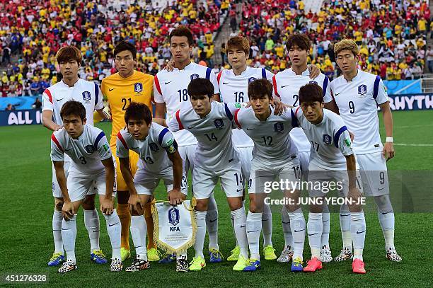 South Korea's defender Kim Young-Gwon, South Korea's goalkeeper Kim Seung-Gyu, South Korea's forward Kim Shin-Wook, South Korea's midfielder Ki...