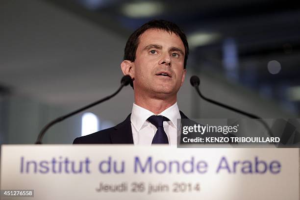 French Prime minister Manuel Valls delivers a speech after viewing the exhibition "Hajj, the pilgrimage to Mecca" , on June 26, 2014 in Paris. The...