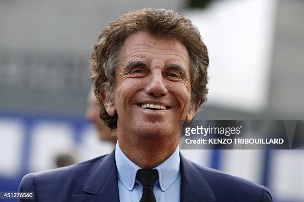 President of the Arab World Institute Jack Lang smiles before going to the exhibition "Hajj, the pilgrimage to Mecca" , on June 26, 2014 at the IMA...