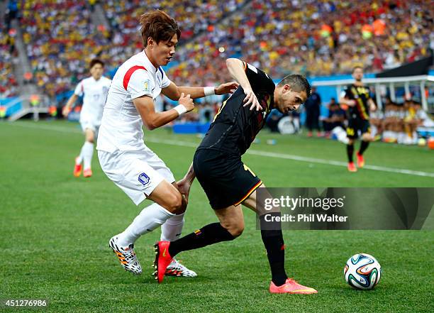 Hong Jeong-Ho of South Korea challenges Kevin Mirallas of Belgium during the 2014 FIFA World Cup Brazil Group H match between South Korea and Belgium...