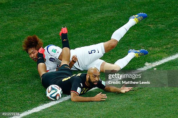 Kim Young-Gwon of South Korea and Anthony Vanden Borre of Belgium collide during the 2014 FIFA World Cup Brazil Group H match between South Korea and...