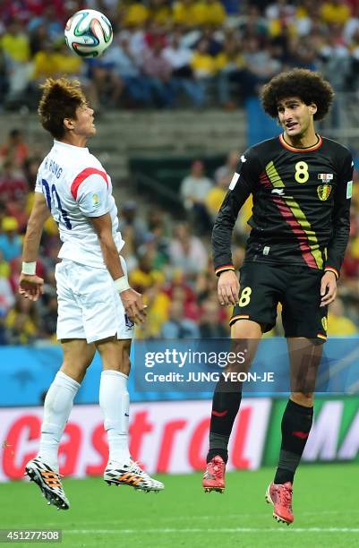 Belgium's midfielder Marouane Fellaini vies with South Korea's defender Hong Jeong-Ho during a Group H football match between South Korea and Belgium...